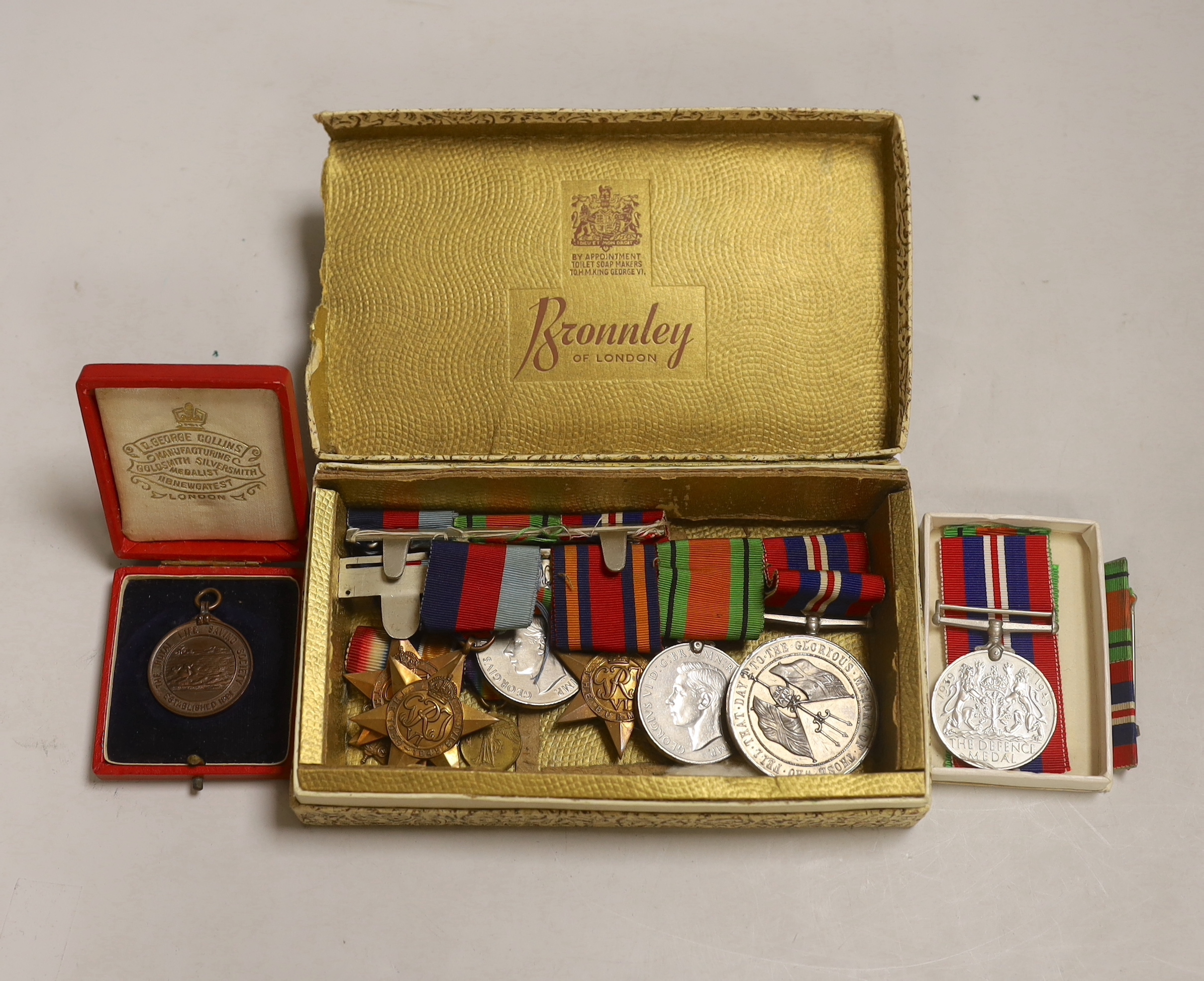 Three WWII medal groups and a German medal etc.